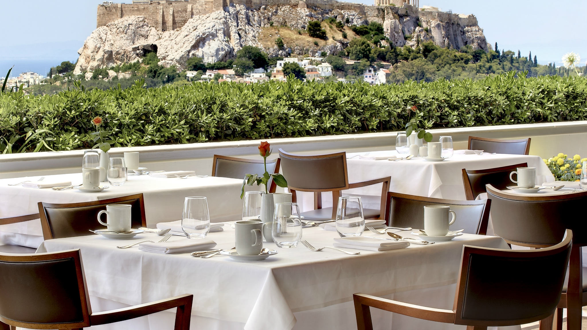 Enjoy lunch with views to the Acropolis from the roof-top GB Roof Garden Restaurant at Hotel Grande Bretagne Athens