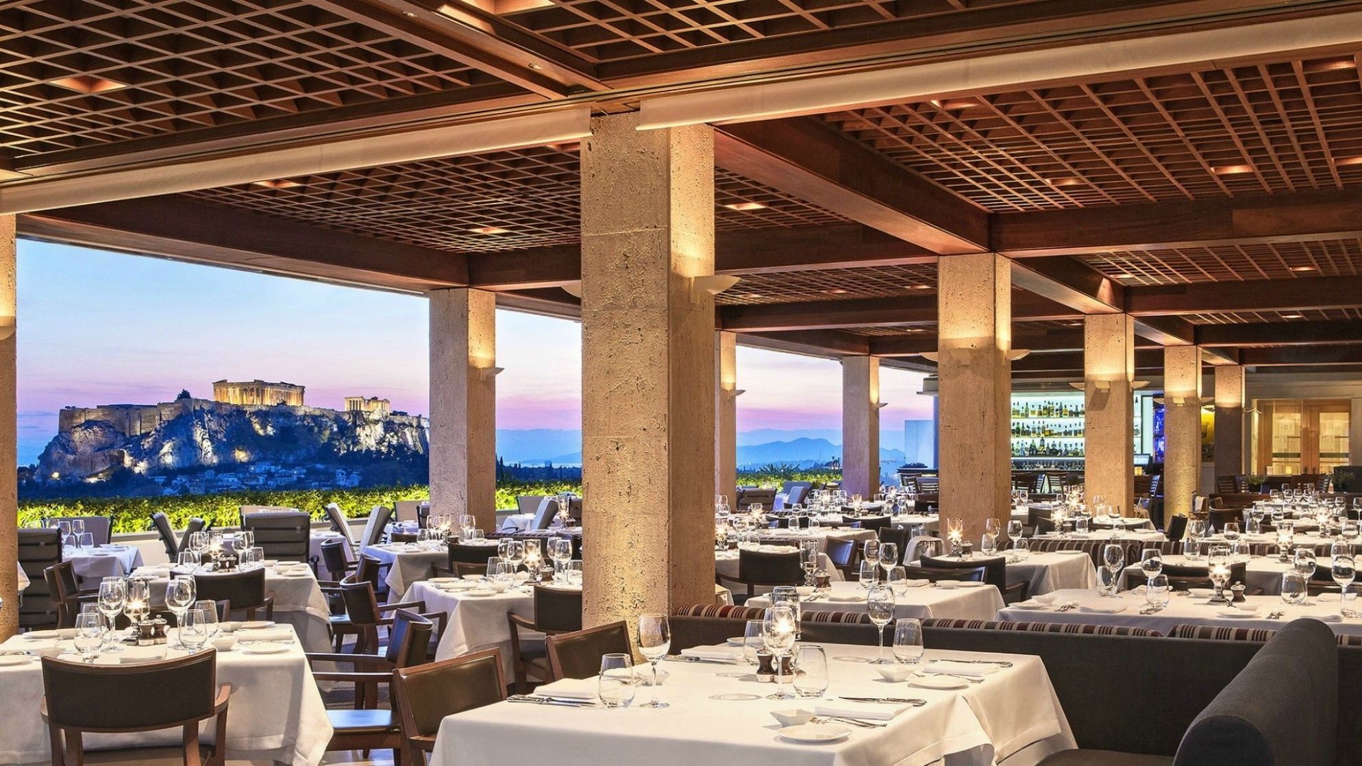 Romantic dinner at the GB Roof Garden Restaurant in the heart of Athens with amazing views to the Acropolis.